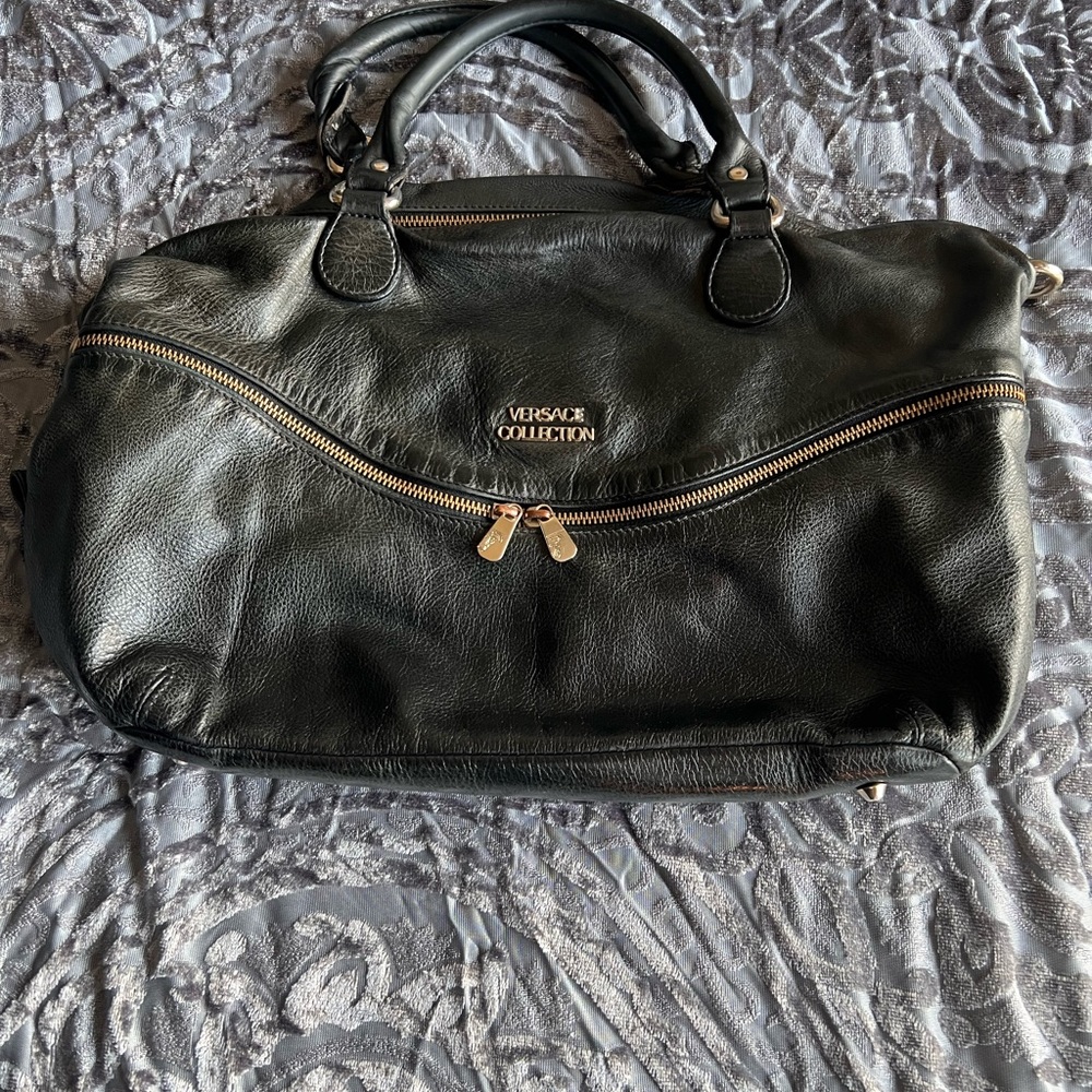 Versace’ black leather satchel pocketbook